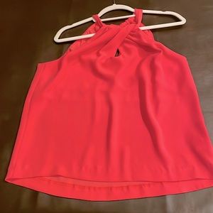 Trina Turk coral top with keyhole twist at neckline. Tie in back